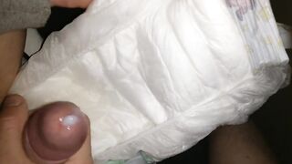 Twink cumming his wet diaper